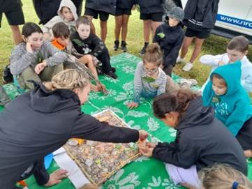 A picture containing clothing, person, group, grass

Description automatically generated