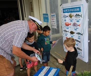 A picture containing clothing, person, human face, child

Description automatically generated