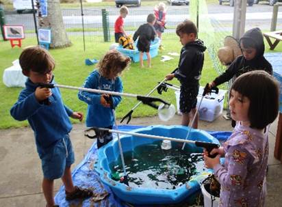 A group of children playing with water

Description automatically generated with low confidence