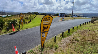 A sign on the side of a road

Description automatically generated