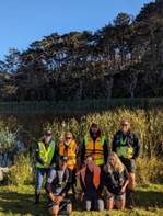 A group of people posing for a photo

Description automatically generated