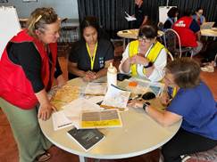 A group of people sitting around a table

Description automatically generated