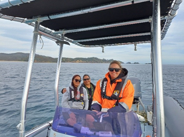 A group of people on a boat

Description automatically generated