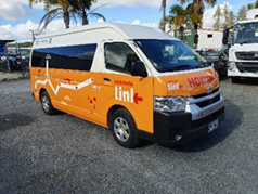 A yellow and white van

Description automatically generated