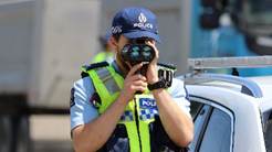 A person in a police uniform holding a camera

AI-generated content may be incorrect.