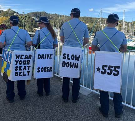 A group of people holding signs

AI-generated content may be incorrect.